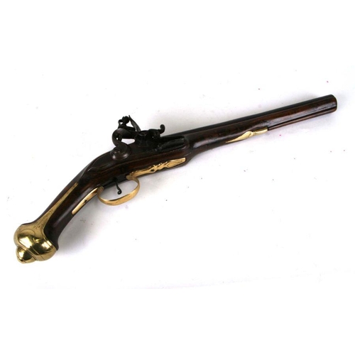 60 - An 18th century flintlock pistol with engraved barrel and brass mounts (recently restored), barrel l... 