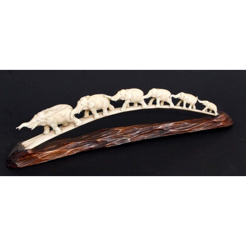 612 - An early 20th century carved ivory chain of elephants. 43cm long