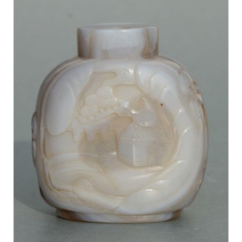 627 - A Chinese figured agate snuff bottle decorated with figures, 6cms high.