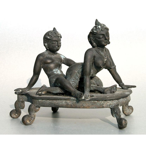 629 - An Asian bronze erotic group, 20cms wide.