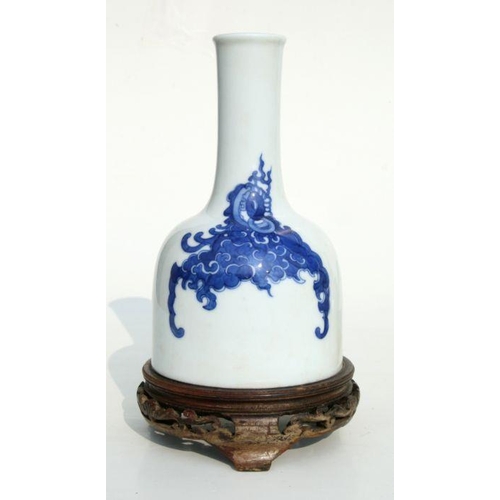 637 - A Chinese blue & white vase of mallet form, six character blue mark to the underside, on a hardwood ... 