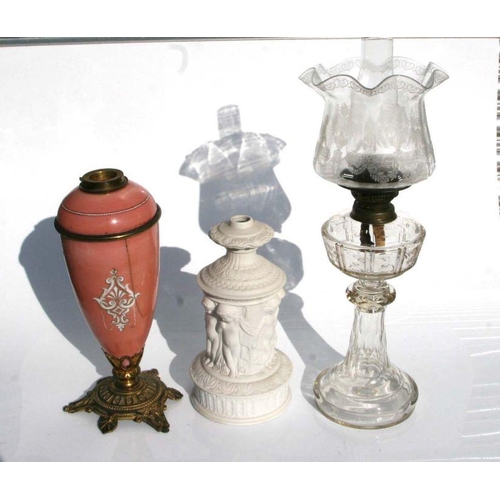 656 - A Victorian cut glass oil lamp, overall 65cms high; together with a Parian style oil lamp base and a... 