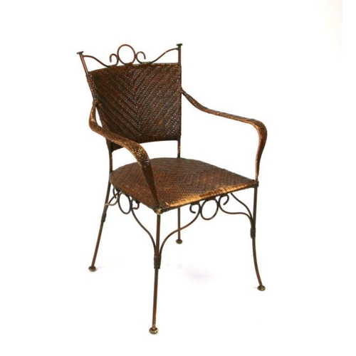 669 - A Carlo Bugatti style wirework and cane armchair.