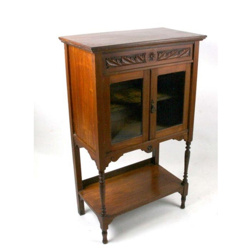 671 - An Edwardian walnut display cabinet, the pair of glazed doors enclosing a shelved interior with unde... 