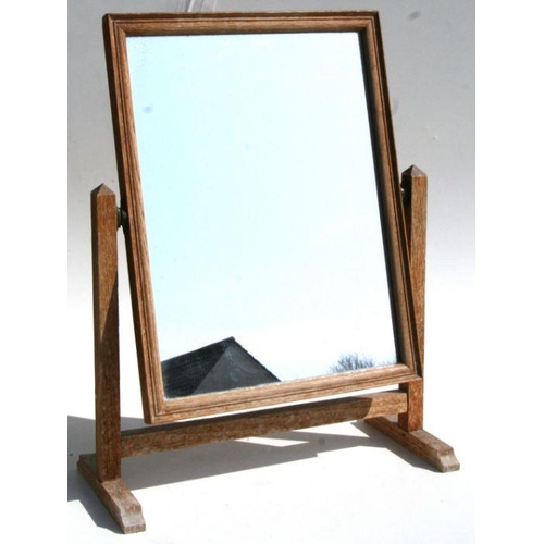 674 - A limed oak toilet mirror, possibly Heals. 40cms wide.