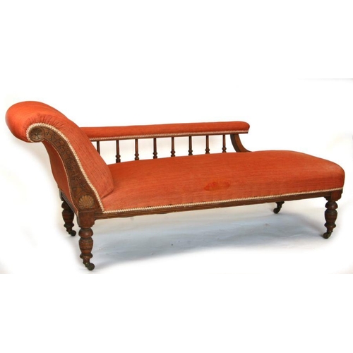 675 - An Edwardian walnut chaise longue with upholstered arm and seat, 73cms long.