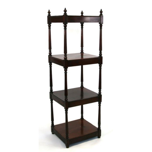 676 - A Victorian walnut four-tier whatnot with turned supports, 40cms wide.