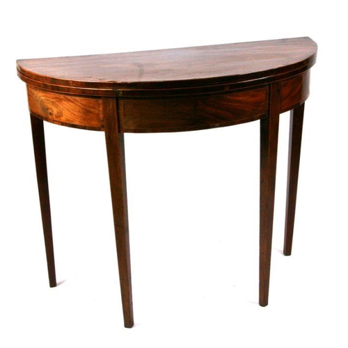 680 - A 19th century figured mahogany demi-lune card table on square tapering legs. 91cm wide