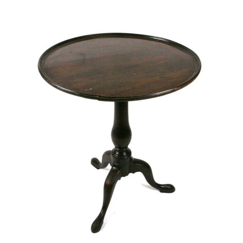 684 - A George III mahogany occasional table on turned column and tripod base, 58cms diameter.