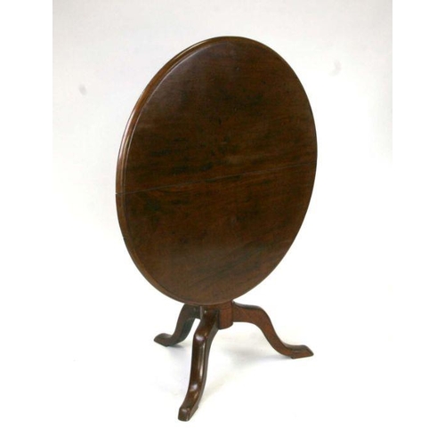 689 - A George III mahogany tilt-top table on tripod base, 87cms wide.