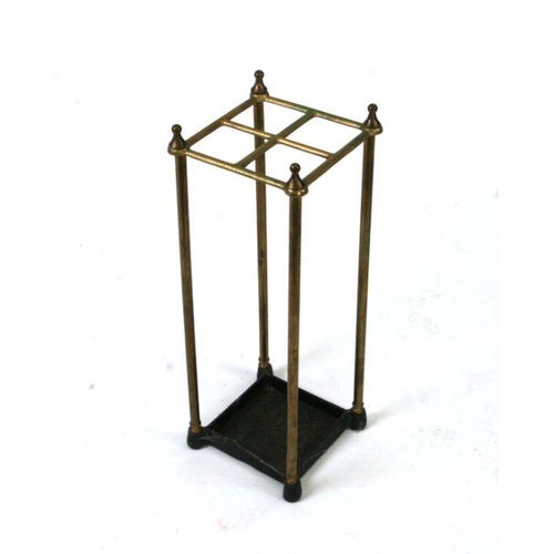 704 - A brass four-division stick stand, 19cms wide.