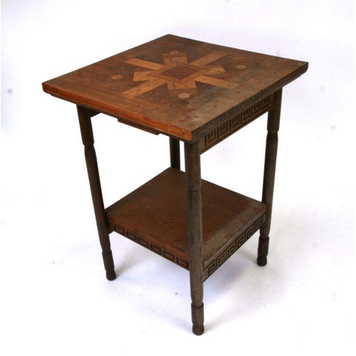 707 - An Arts & Crafts style inlaid two-tier occasional table, 53cms wide.