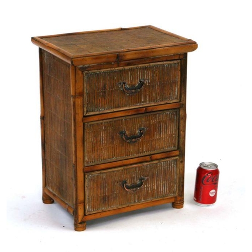 708 - A miniature bamboo chest with three drawers, 38cms wide.Condition ReportMissing the upright strip of... 