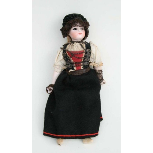 71 - A German bisque headed doll, 31cms high.