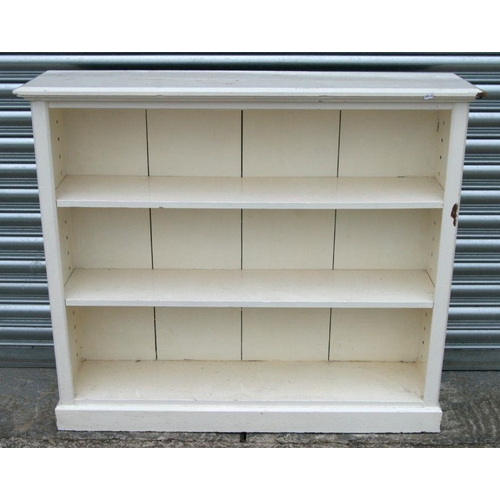 712 - A painted pine open bookcase, 108cms wide.