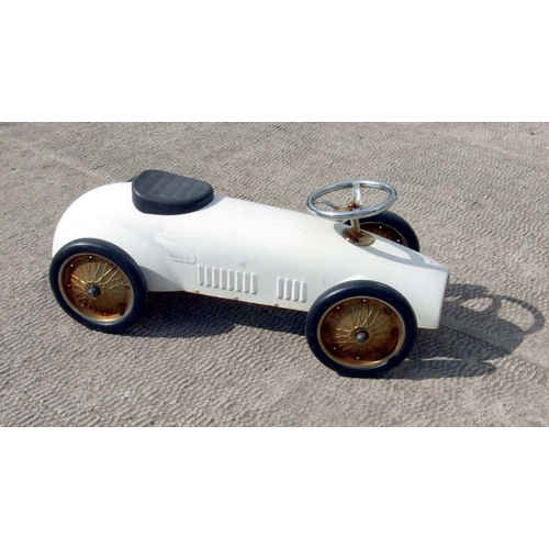 73 - A push-along toy racing car, 79cms long.