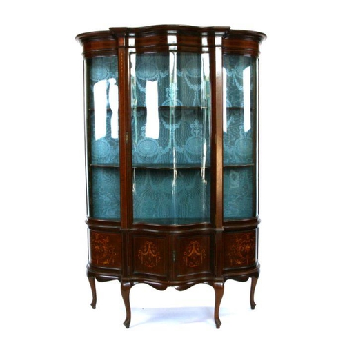 738 - An Edwardian mahogany bowfront glazed display cabinet in the Sheraton taste, on dwarf cabriole legs,... 