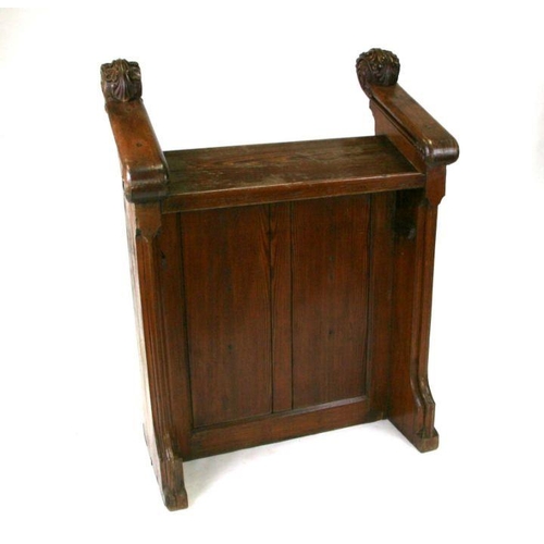 740 - A carved pitch pine lectern, 90cms wide.