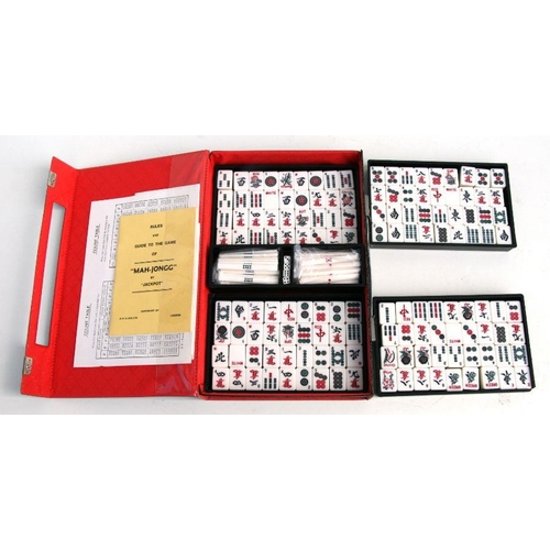 76 - A modern cased Mah Jong set.