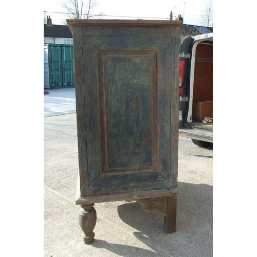 769 - A large Asian hardwood two door cupboard on turned front legs