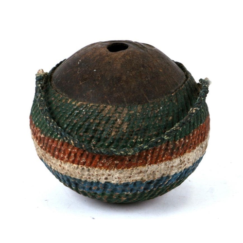 77 - A 19th century coconut 'Bugbear' style flask with painted woven decoration, 13cms high.