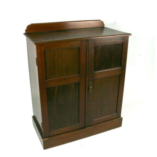 786 - An Edwardian figured walnut two-door cupboard, 80cms wide.