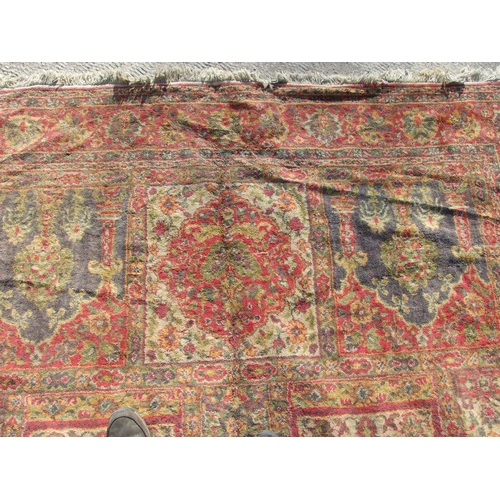 91 - A Turkish carpet with central floral medallion on a red ground, 202 by 286cms.