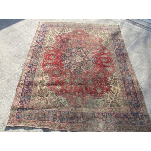 92 - A Persian rug with foliate design on a blue ground 304 by 377cms.