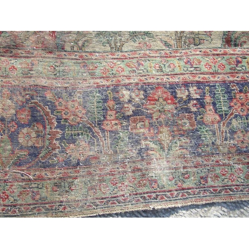 92 - A Persian rug with foliate design on a blue ground 304 by 377cms.