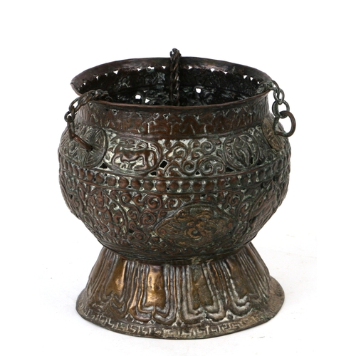 599 - A Tibetan pierced copper hanging lamp, 17cms  high.