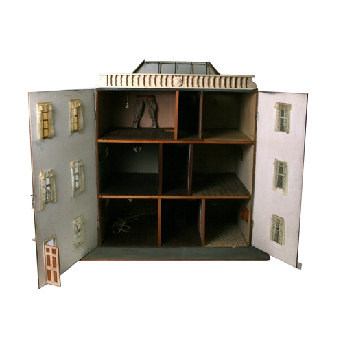 70 - A vintage dolls house 'The Manse' together with a large quantity of dolls house furniture and access... 