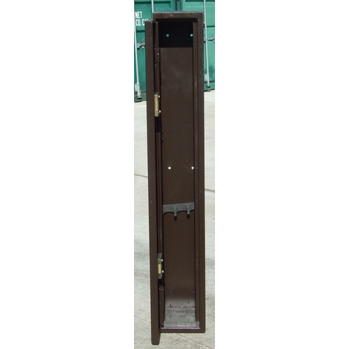 85 - An approved steel gun cabinet, double locks and spare keys, 135cms high.