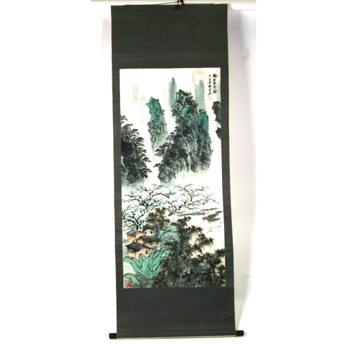 646 - A Chinese scroll painting depicting a mountainous river landscape scene with calligraphy. 60 by 128c... 