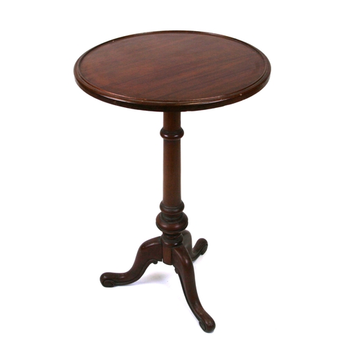 719 - A George III mahogany tripod table with turned column on triform base with pad feet, 46cms diameter.