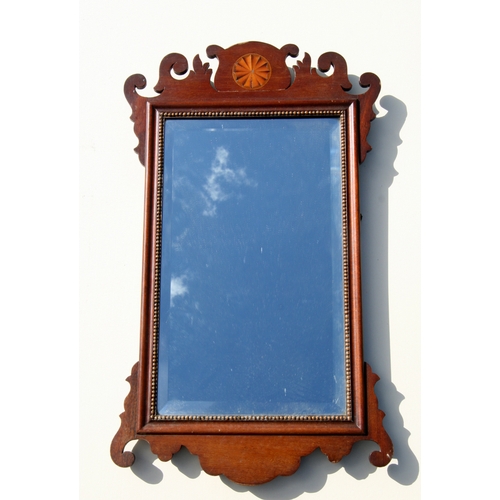 667 - A George II style mahogany fretwork wall mirror with bevelled edged rectangular plate, 40cms wide.