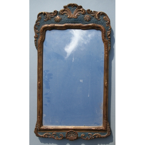 788 - A gilt gesso wall mirror, overall 40 by 71cms.