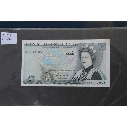 429 - An album containing English banknotes to include 10 shilling note, £1 notes and £5 notes, some in un... 