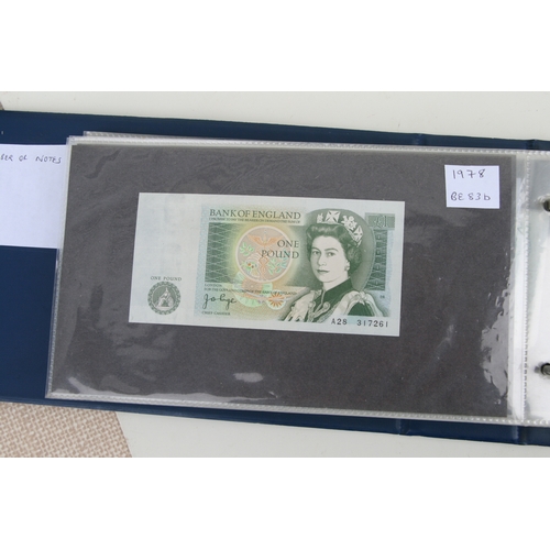 429 - An album containing English banknotes to include 10 shilling note, £1 notes and £5 notes, some in un... 