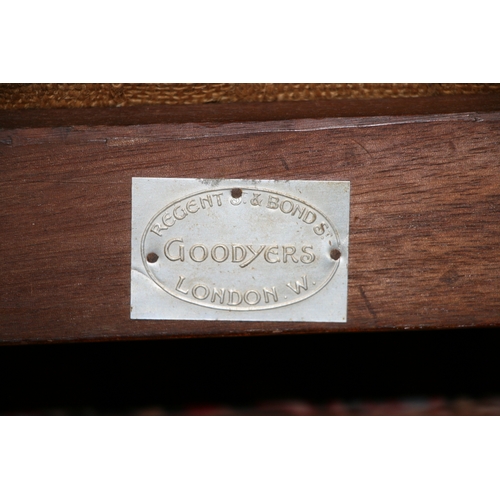 732 - An Arts & Crafts wingback chair with turned spindles, bears plaque 'Goodyer's Regent St & Bond St, L... 