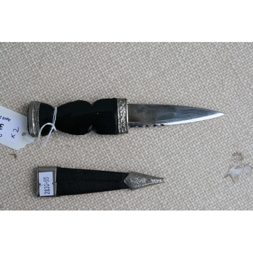 36 - A Scottish Sgian Dubh, the blade signed 'J Nowill & Sons Ltd, in a leather scabbard, 20cms long;... 