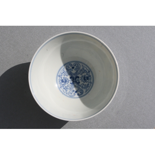 513 - A Chinese blue & white footed bowl decorated with stylised flowers, six character blue mark to t... 