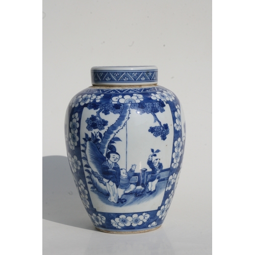 527 - A Chinese blue & white jar and cover decorated with figures within panels on a prunus ground, 27... 