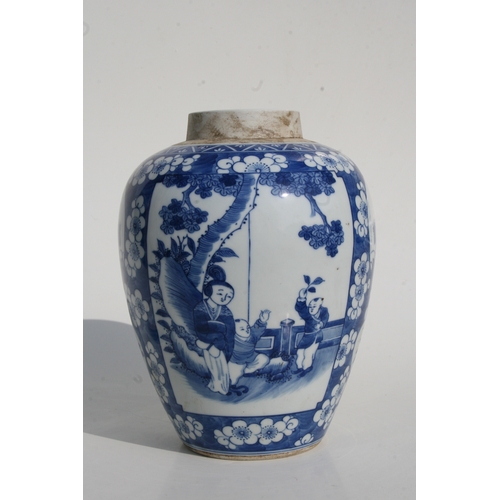 527 - A Chinese blue & white jar and cover decorated with figures within panels on a prunus ground, 27... 