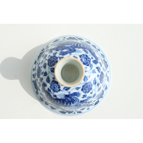 584 - A Chinese blue & white stem cup decorated with shishi amongst scrolling foliage, with six charac... 