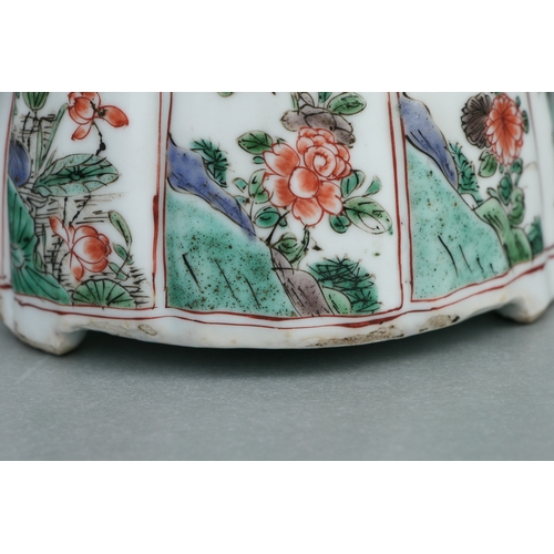 618 - A Chinese famille rose teapot decorated with flowers and insects, 17cms high.