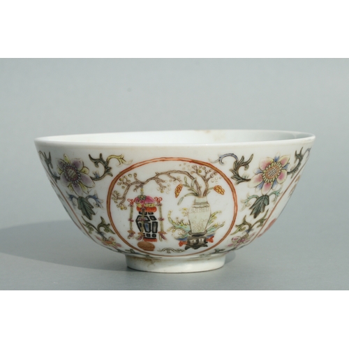 642 - A Chinese famille rose bowl decorated with precious objects within roundels and foliate scrolls, red... 