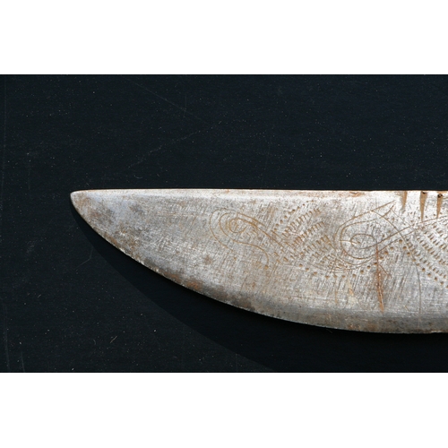 65 - An Indonesian Parang / machete with horn handle, the blade engraved with stylised fish, 51cms long.