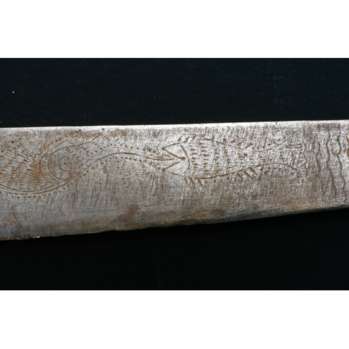 65 - An Indonesian Parang / machete with horn handle, the blade engraved with stylised fish, 51cms long.