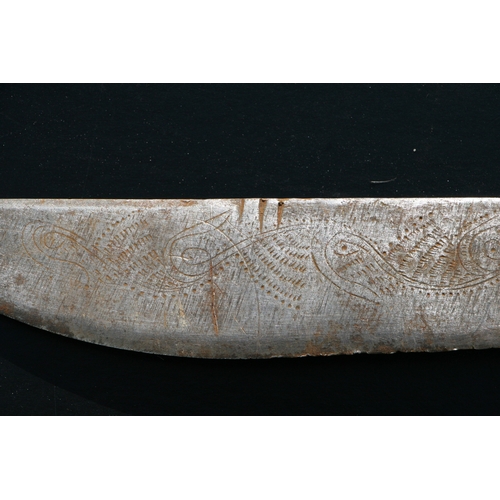 65 - An Indonesian Parang / machete with horn handle, the blade engraved with stylised fish, 51cms long.