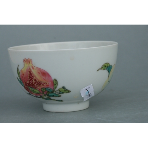 515 - A Chinese footed bowl decorated with fruit to include peaches and pomegranates, six character blue m... 